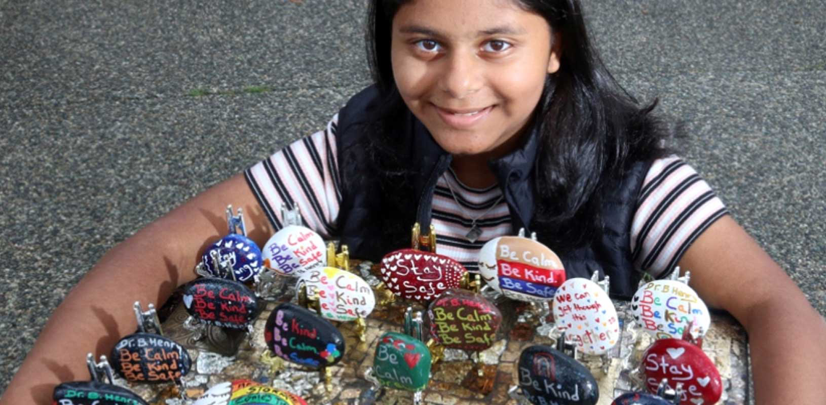 Insiyah Dharsee of the 13th Southwest Ismaili Group shows her display of inspiring Hope Rocks.