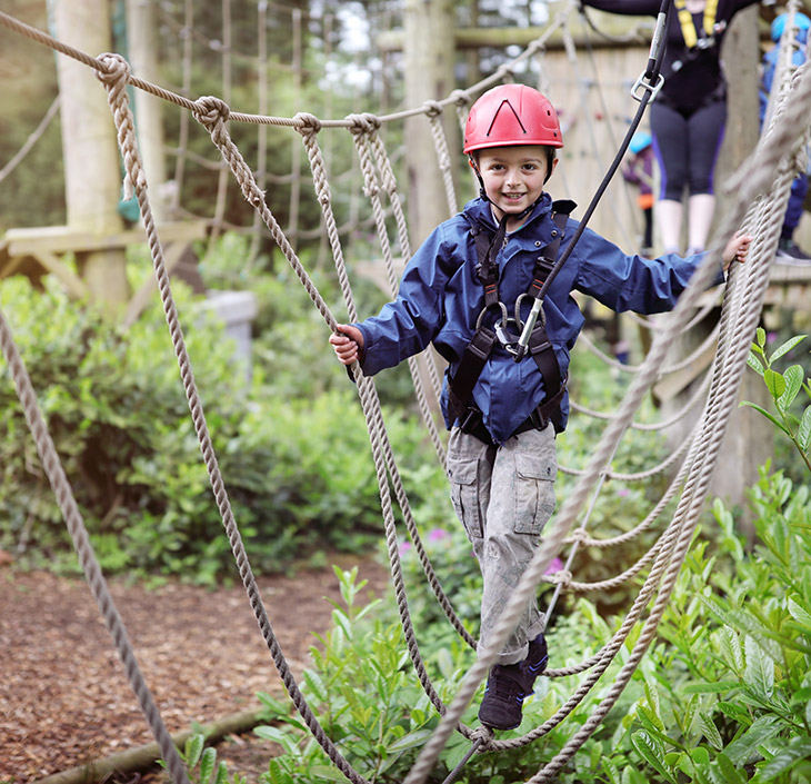 Youth on a rope bridge