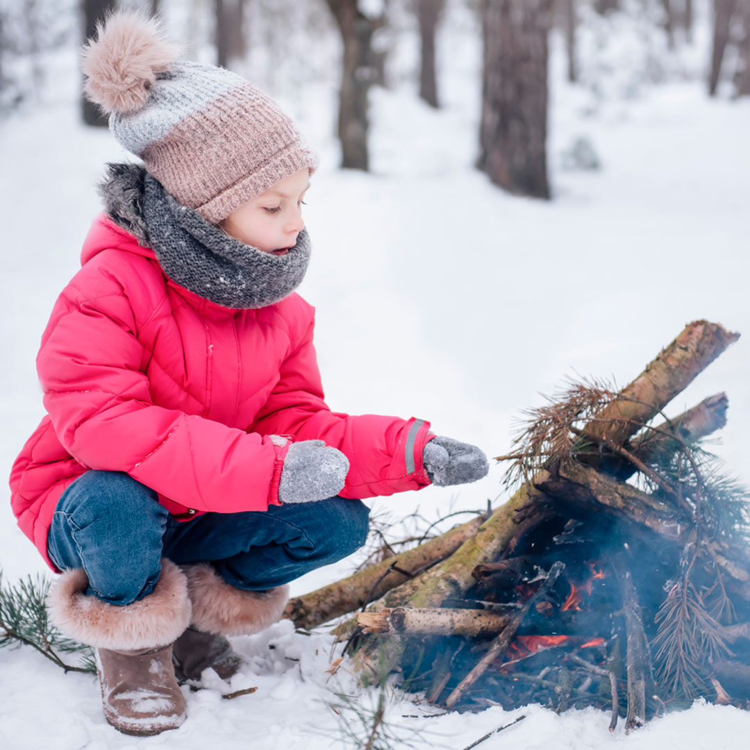 Girl at campfire in Winter